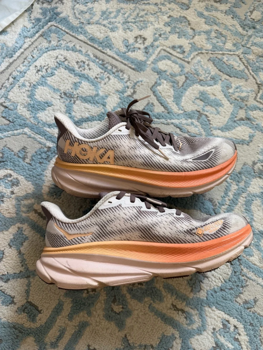 Hoka Women's Clifton Running Shoes in Brown and Orange